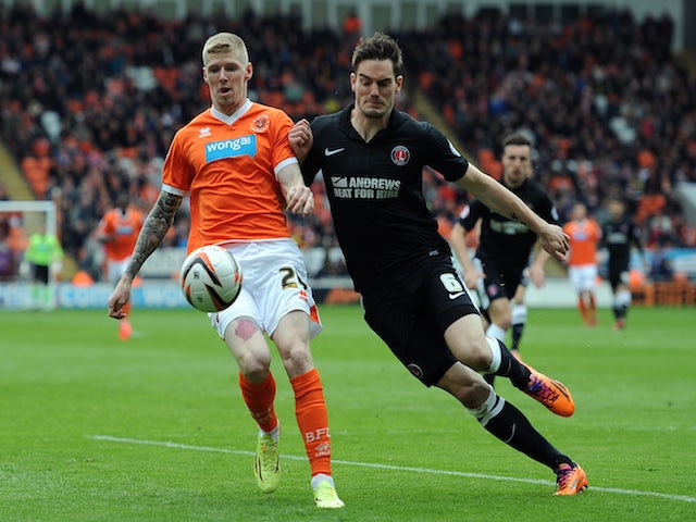 Andy Keogh of Blackpool in action with Dorian Dervite of Charlton Athletic during the Sky Bet Championship match on May 3, 2014
