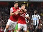 Arsenal's French defender Laurent Koscielny celebrates with Arsenal's French striker Olivier Giroud after he scored his team's opening goal during the English Premier League football match between Arsenal and Newcastle United at the Emirates Stadium in Lo