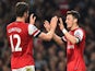 Arsenal's German midfielder Mesut Ozil celebrates with Arsenal's French striker Olivier Giroud after Ozil scored his team's second goal during the English Premier League football match between Arsenal and Newcastle United at the Emirates Stadium in London