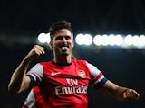 Olivier Giroud of Arsenal celebrates as he scores their third goal during the Barclays Premier League match between Arsenal and Newcastle United at Emirates Stadium on April 28, 2014