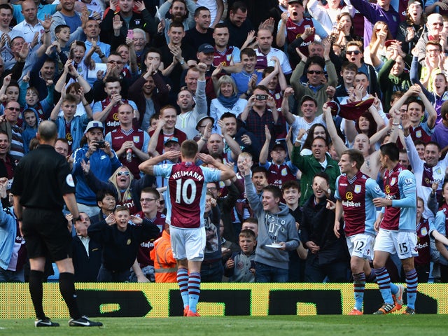 Andreas Weimann of Aston Villa celebrates his goal with Aston Villa fans during the Barclays Premier League match between Aston Villa and Hull City at Villa Park on May 3, 2014 