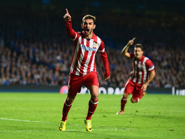 Adrian Lopez of Club Atletico de Madrid celebrates scoring his goal during the UEFA Champions League semi-final second leg match between Chelsea and Club Atletico de Madrid at Stamford Bridge on April 30, 2014