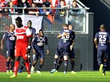 Bordeaux's French defender Julien Faubert celebrates with teammates after scoring a goal during the French L1 football match between Valenciennes and Bordeaux at the Stade du Hainaut in Valenciennes on May 4, 2014