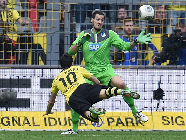 Dortmund's Armenian midfielder Henrikh Mkhitaryan (L) scores during the German first division Bundesliga football match Borussia Dortmund vs 1899 Hoffenheim in Dortmund, western Germany, on May 3, 2014