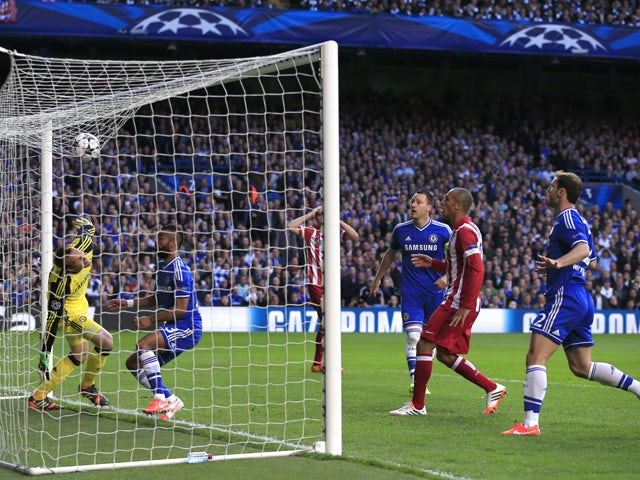 Caption:The ball lands on Chelsea's net after a corner from Atletico Madrid during the UEFA Champions League semi-final second leg football match between Chelsea and Atletico Madrid at Stamford Bridge in London on April 30, 2014