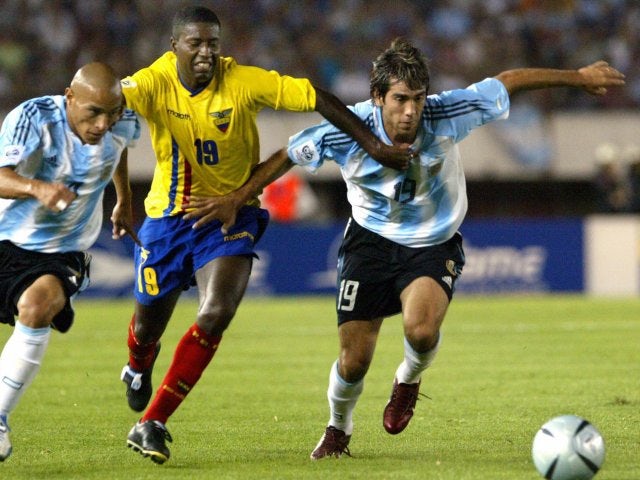 Ecuador's Edison Mendez battles for possession against Argentina on March 30, 2004.
