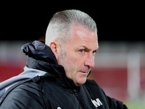 Gateshead manager Gary Mills stands on the touchline during a match against Oxford United on December 05, 2013.