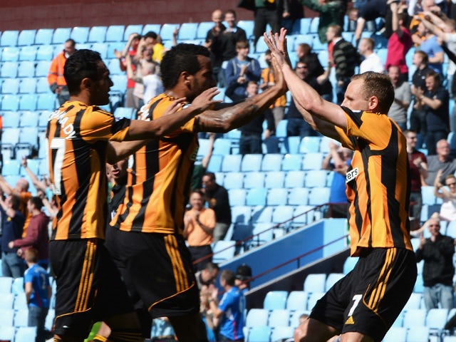 David Meyler of Hull City celebrates their equalising goal, an own goal by Jordan Bowery of Aston Villa, with Tom Huddlestone and Ahmed Elmohamady during the Barclays Premier League match between Aston Villa and Hull City at Villa Park on May 3, 2014