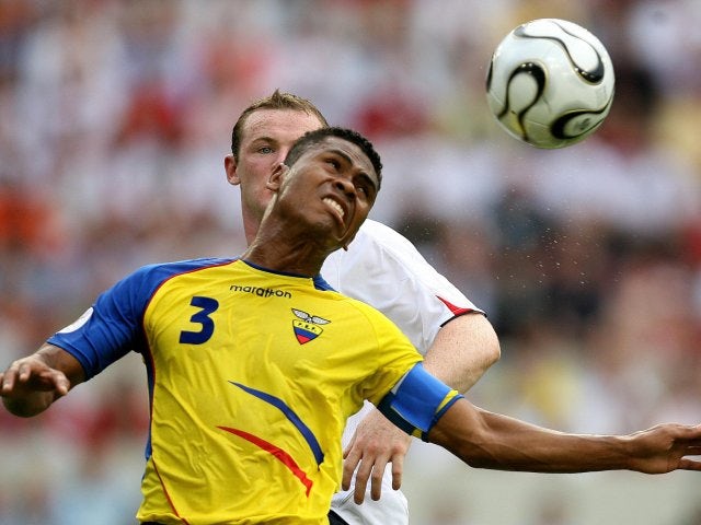 Ecuador defender Ivan Hurtado jumps for the ball against England striker Wayne Rooney on June 25, 2006.