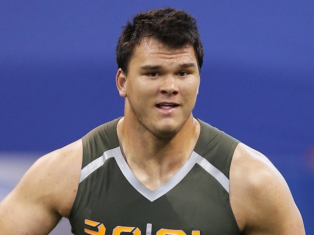 Former Texas A&M offensive lineman Jake Matthews takes part in a drill during the 2014 NFL Combine at Lucas Oil Stadium on February 22, 2014
