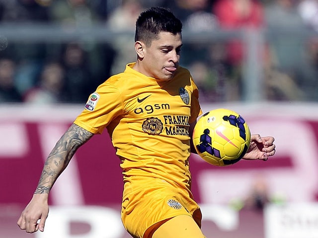 Juan Iturbe of Hellas Verona FC in action during the Serie A match between AS Livorno Calcio and Hellas Verona FC at Stadio Armando Picchi on February 23, 2014