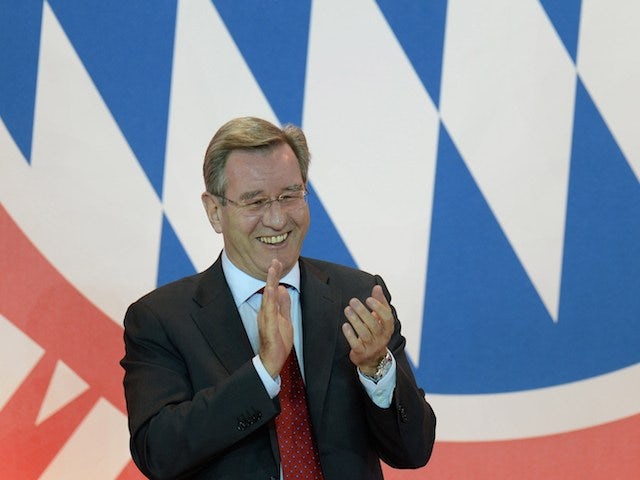 Karl Hopfner, newly elected President of FC Bayern Munich laughs and applauds during the annual general meeting of FC Bayern Munich in Munich, southern Germany, on May 2, 2014