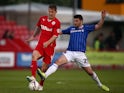 Kyle McFadzean of Crawley Town battles for possesion with Danny Redmond of Carlisle United during the Sky Bet League One match on April 29, 2014