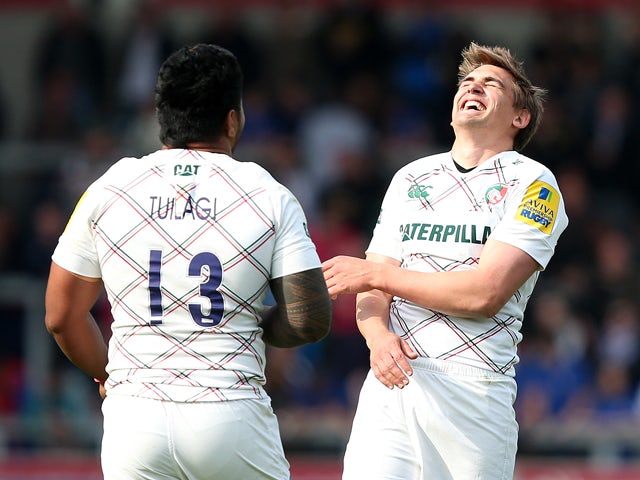 Toby Flood of Leicester Tigers shares a joke with Manu Tuilagi during the Aviva Premiership match between Sale Sharks and Leicester Tigers at AJ Bell Stadium on May 3, 2014
