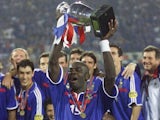 France defender Lilian Thuram lifts the European Championships trophy on July 02, 2000.