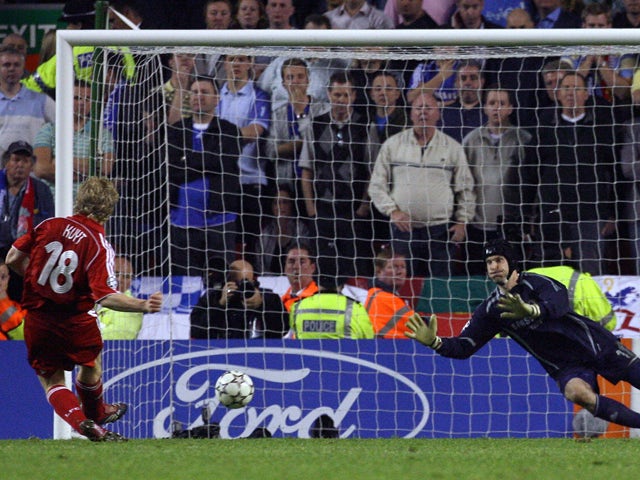 Liverpool's Dutch forward Dirk Kuyt scores the winning penalty past Chelsea's Czech goalkeeper Petr Cech to win the European Champions League semi final second leg football match at Anfield, Liverpool, north west England, 01 May 2007