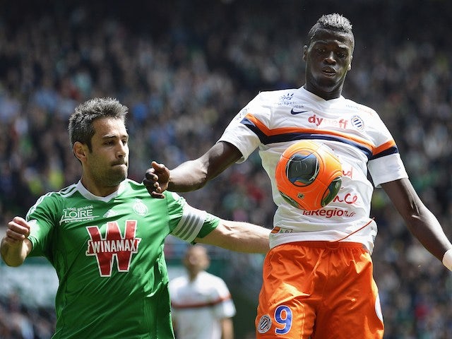 Montpellier's French forward Mbaye Niang (R) vies with St Etienne's French defender Loic Perrinduring the French L1 football match on May 4, 2014