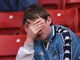 A Manchester City fan reacts to his team being relegated to Division Two on May 03, 1998.