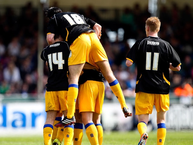 Colin Daniel of Mansfield is mobbed by team mates after scoring the opening goal of the game during the Sky Bet League Two match between Bristol Rovers and Mansfield Town at Memorial Stadium on May 3, 2014