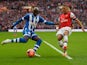 Marc-Antoine Fortune of Wigan Athletic crosses the ball under pressure from Kieran Gibbs of Arsenal during the FA Cup Semi-Final match between Wigan Athletic and Arsenal at Wembley Stadium on April 12, 2014