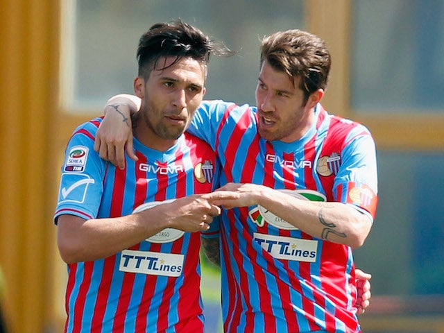 Mariano Izco of Catania celebrates with his team-mate Lucas Castro after scoriing their second goal during the Serie A match against AS Roma on May 4, 2014