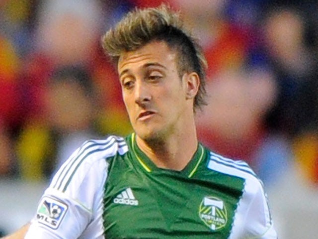 Maximiliano Urruti #37 of the Portland Timbers try for the ball during their game at Rio Tinto Stadium April 19, 2014