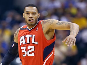 Mike Scott of the Atlanta Hawks celebrates after making a three point shot against the Indiana Pacers in Game 5 of the Eastern Conference Quarterfinals on April 28, 2014