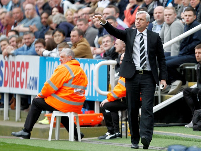 Newcastle United manager, Alan Pardew makes arare appearance out out of the dug-out during the Barclays Premier League match between Newcastle United and Cardiff City at St. James' Park on May 03, 2014