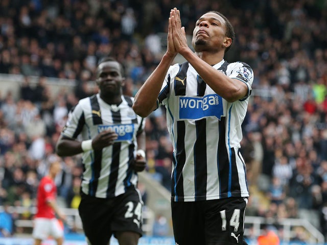 Newcastle United's French striker Loic Remy celebrates scoring his team's second goal during the English Premier League football match between Newcastle United and Cardiff City at St James' Park in Newcastle-upon-Tyne, northeast England, on May 3, 2014
