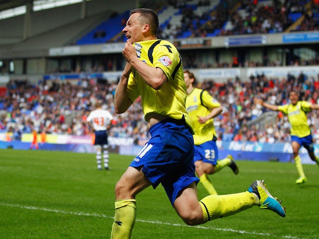 Paul Caddis of Birmingham City celebrates as he scores their second goal with a header to equalise during the Sky Bet Championship match against Bolton Wanderers on May 3, 2014