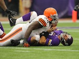 Christian Ponder #7 of the Minnesota Vikings reacts to a tackle by Phillip Taylor #98 of the Cleveland Browns on September 22, 2013