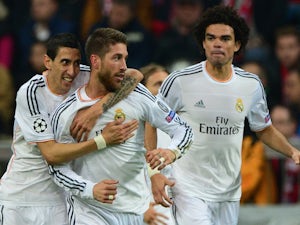 Real Madrid's defender Sergio Ramos (C) celebrates scoring the second goal against Bayern Munich with his teammates on April 29, 2014