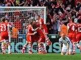Rickie Lambert of Southampton is congratulated by team mates as he scores during the Barclays Premier League match between Swansea City and Southampton at Liberty Stadium on May 3, 2014