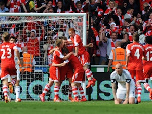 Rickie Lambert of Southampton is congratulated by team mates as he scores during the Barclays Premier League match between Swansea City and Southampton at Liberty Stadium on May 3, 2014
