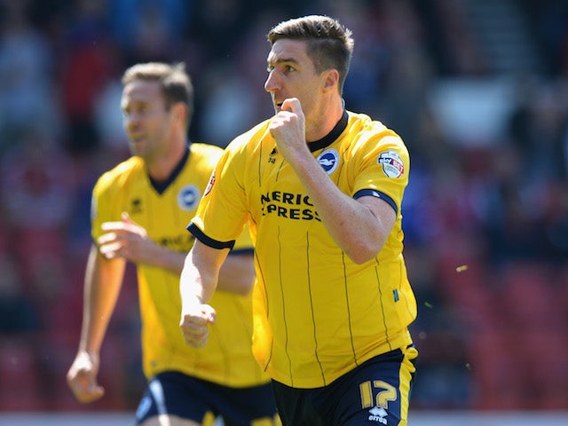 Stephen Ward of Brighton & Hove Albion celebrates scoring their first goal during the Sky Bet Championship match against Nottingham Forest on May 3, 2014