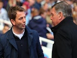 Tim Sherwood the Spurs manager is greeted by Sam Allardyce the West Ham manager during the Barclays Premier League match on May 3, 2014