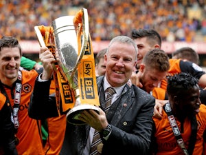 Wolves manager Kenny Jackett lifts the Sky Bet League One trophy during the Sky Bet League One match between Wolverhampton Wanderers and Carlisle United at Molineux on May 3, 2014 