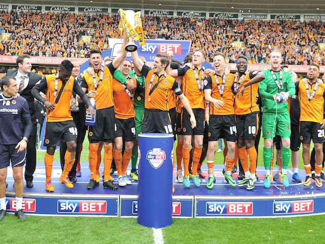 Wolves players celebrate after with the League One trophy on May 3, 2014
