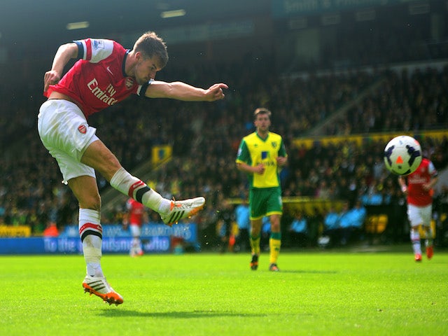 Aaron Ramsey of Arsenal scores the opening goal during the Barclays Premier League match between Norwich City and Arsenal at Carrow Road on May 11, 2014