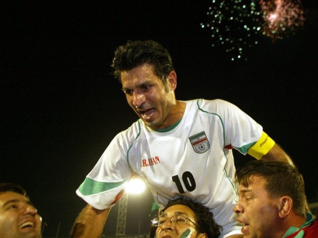 Iran striker Ali Daei is held aloft by supporters on June 08, 2005.