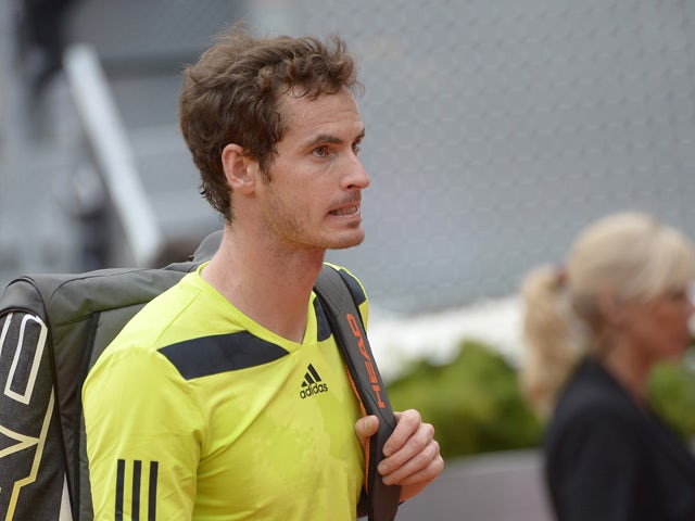 British player Andy Murray leaves after the men's singles third round tennis match against Colombian player Santiago Giraldo at the Madrid Masters at the Magic Box (Caja Magica) sports complex in Madrid on May 8, 2014