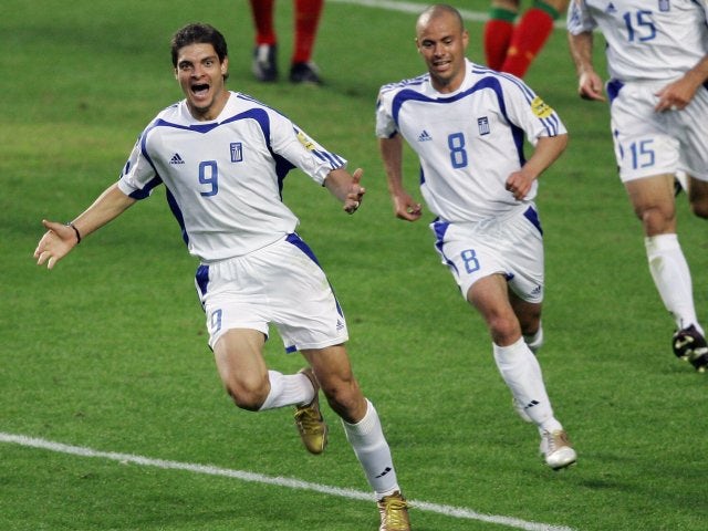Greece striker Angelos Charisteas celebrates scoring during the European Championships final on July 04, 2004.