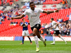 Britt Assombalonga of Peterborough celebrates after scoring his team's third goal of the game during the Johnstone's Paint Trophy Final between Chesterfield and Peterborough United at Wembley Stadium on March 30, 2014