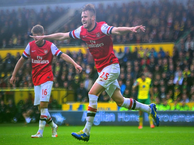 Carl Jenkinson of Arsenal celebrates scoring the second goal during the Barclays Premier League match between Norwich City and Arsenal at Carrow Road on May 11, 2014