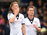 Cauley Woodrow (L) of Fulham celebrates his goal during the Barclays Premier League match between Fulham and Crystal Palace at Craven Cottage on May 11, 2014