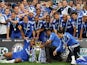Chelsea players celebrate with the Barclays Premier League trophy after they win the title with a 8-0 victory over Wigan Athletic in the English Premier League football match on May 9, 2010