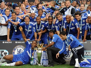 Chelsea players celebrate with the Barclays Premier League trophy after they win the title with a 8-0 victory over Wigan Athletic in the English Premier League football match on May 9, 2010