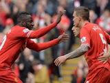 Liverpool's Danish defender Daniel Agger (Foreground R) celebrates with Liverpool's Uruguayan striker Luis Suarez (2nd R) and Liverpool's French defender Aly Cissokho on May 11, 2014