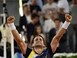 David Ferrer celebrates victory over Ernests Gulbis in their quarter final Madrid Masters match on May 9, 2014
