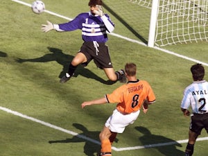 Dennis Bergkamp scores for Holland against Argentina on July 04, 1998.